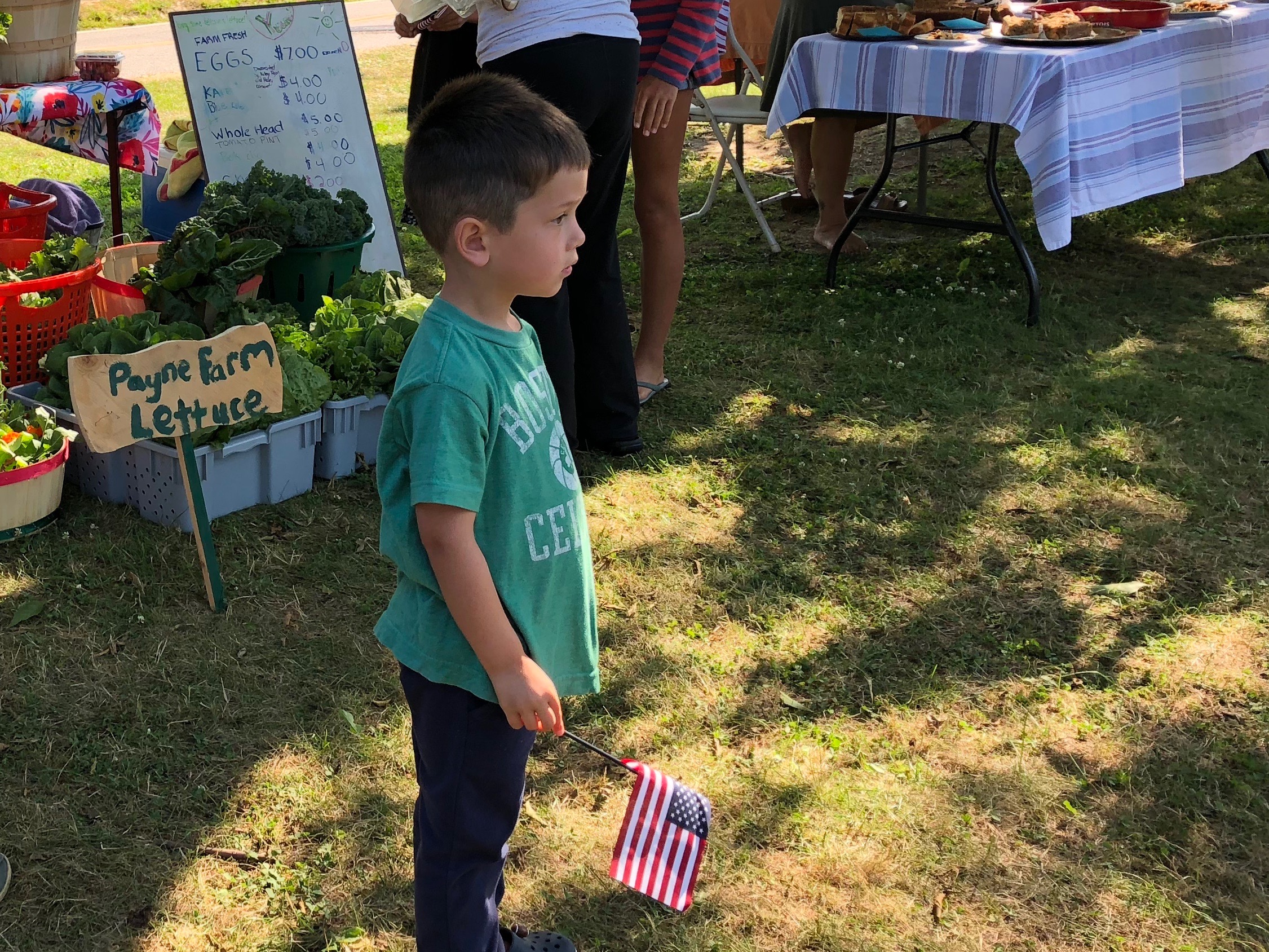 072118-boy-listening-to-music-at-market