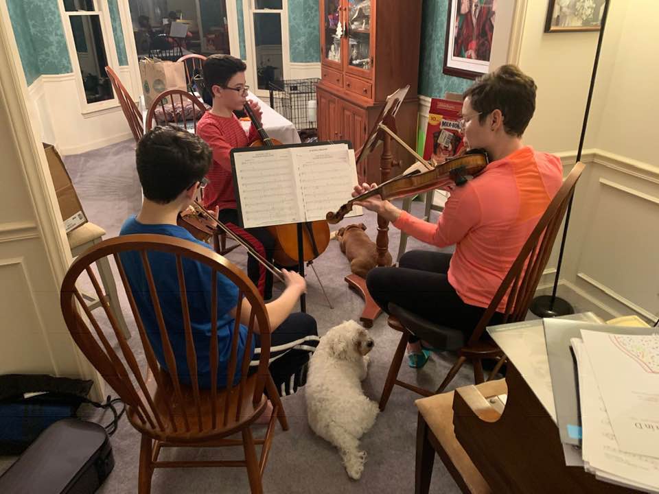 021719-mother-and-sons-and-dog-enjoy-music